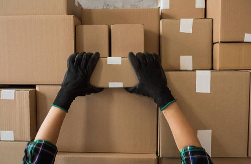 Warehouse Worker Grabbing Package
